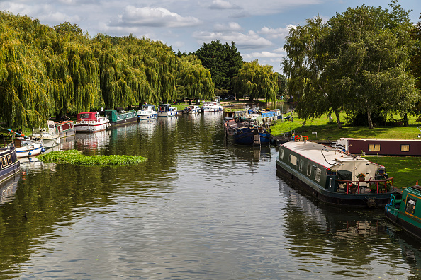 lush greenery and small boats line the River Great Ouse
